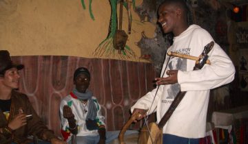 Azmari musician performing in a traditional tejbeit
