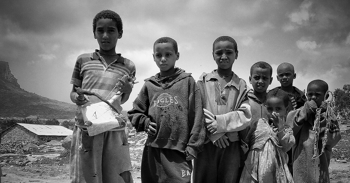 Young musician holds a masenqo, the one-string fiddle of Azmari tradition, in Tigray, Ethiopia